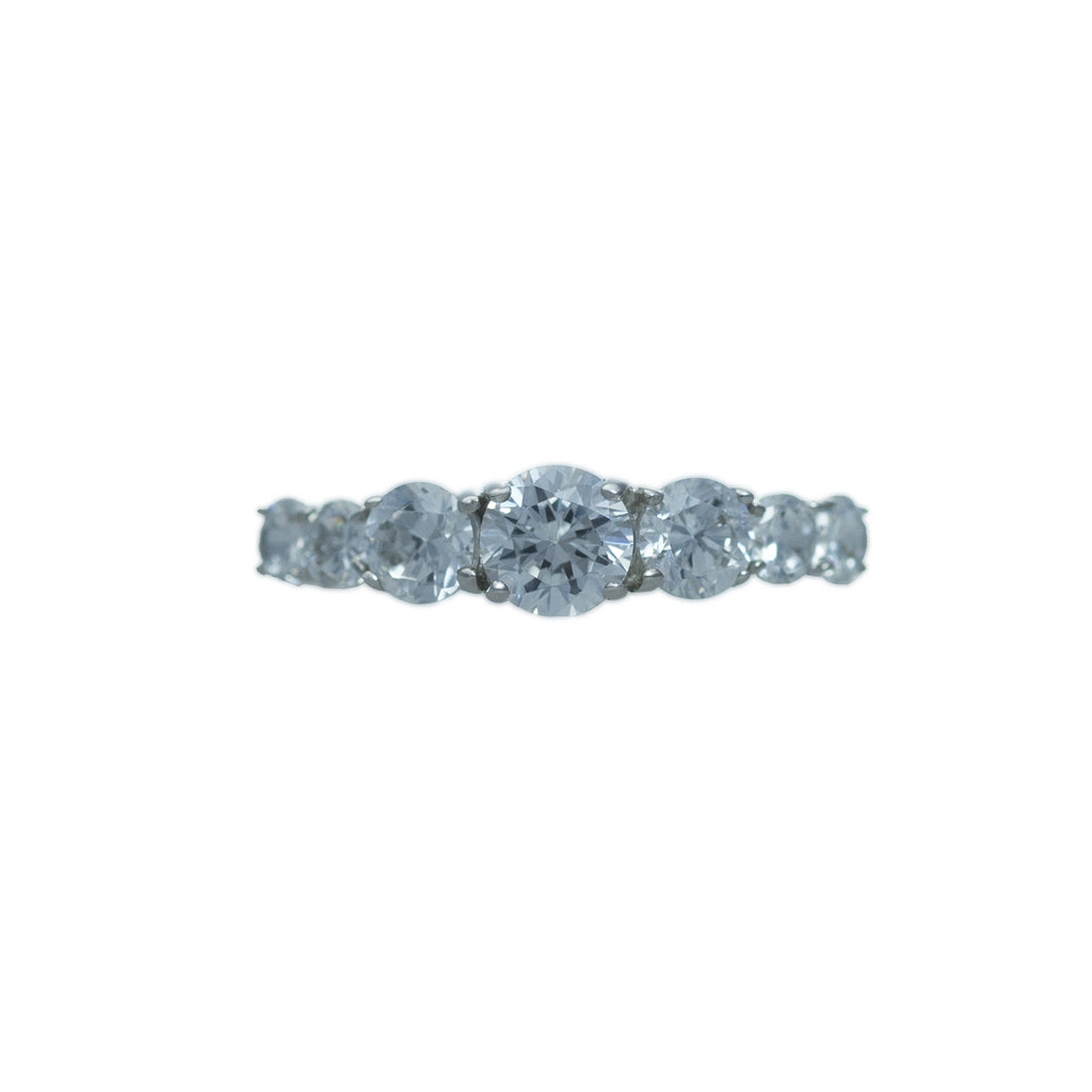Sterling silver, rhodium plated, five round brilliant cut cubic zirconia claw set half eternity ring.