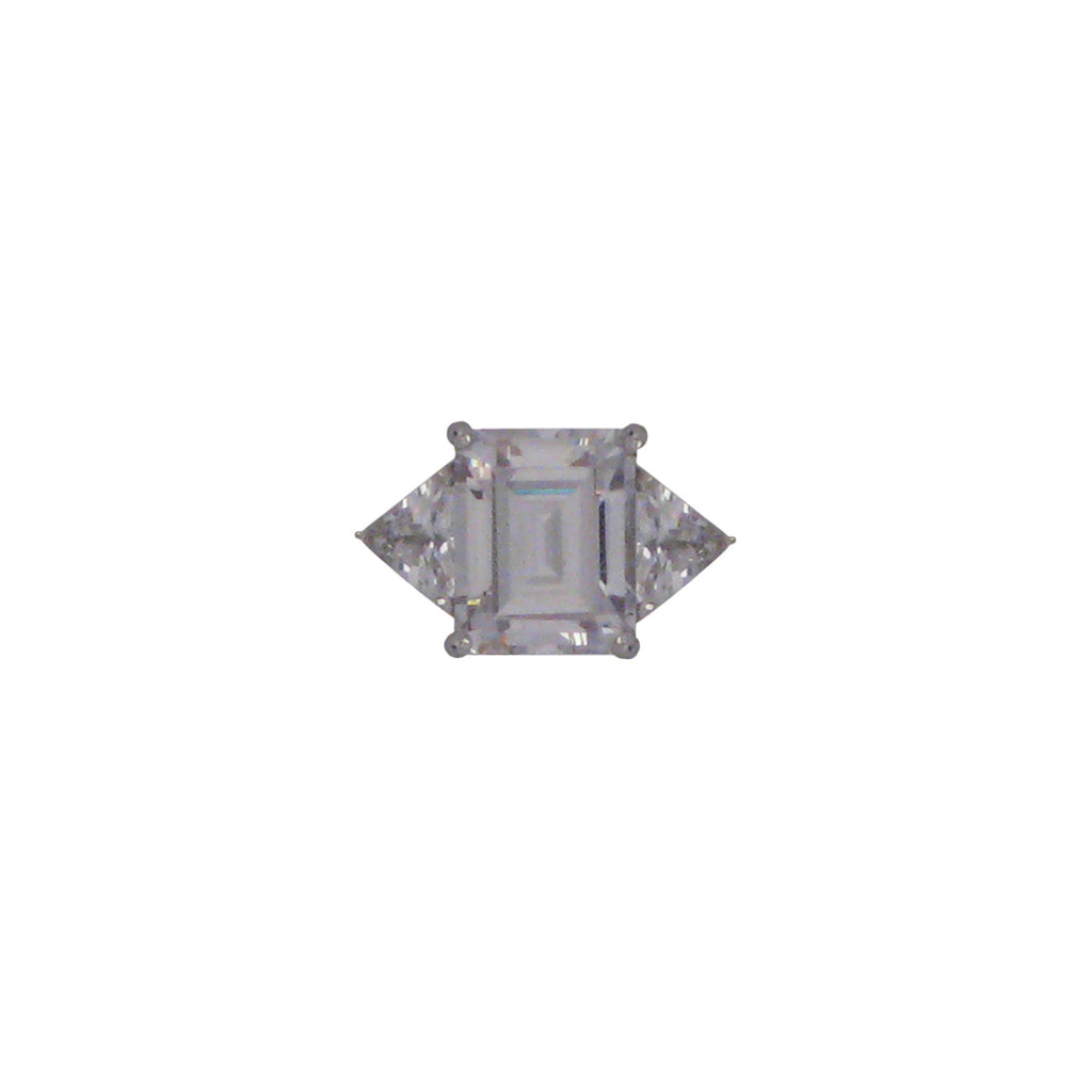 Sterling silver, rhodium plated, large emerald cut cubic zirconia ring with triangle cut cubic zirconia shoulders.