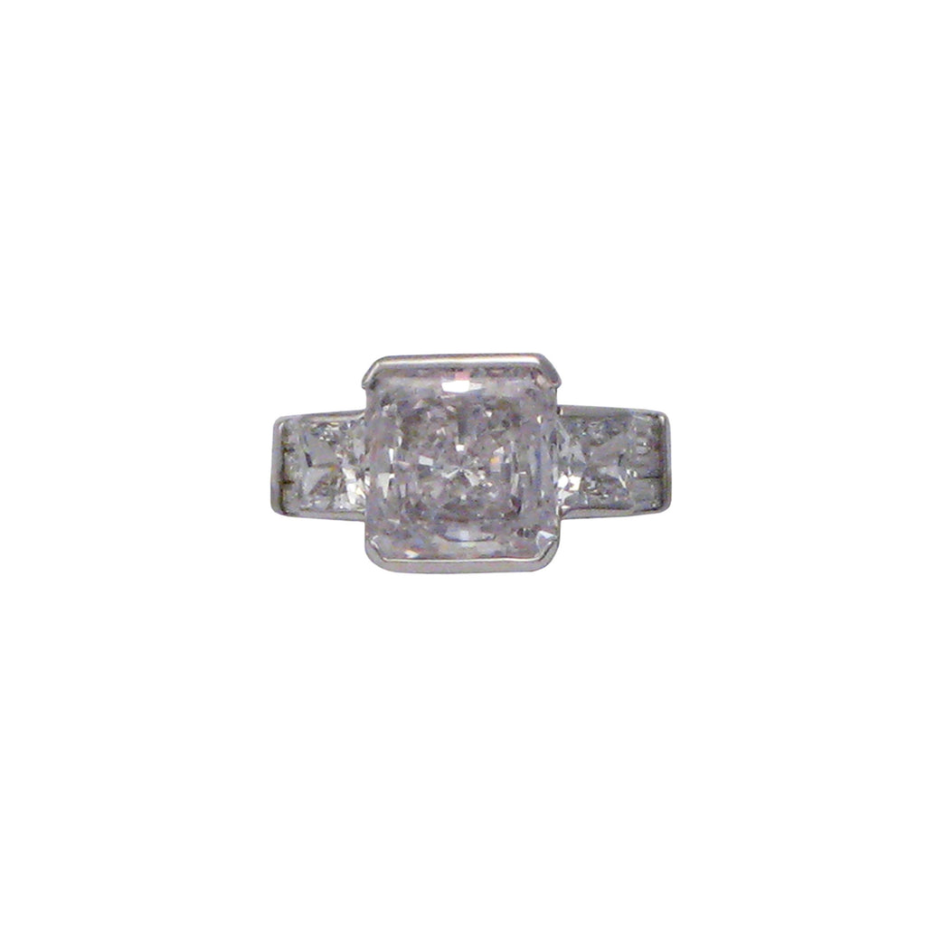 Sterling silver, rhodium plated, large square princess cut cubic zirconia ring with square princess cut cubic zirconia shoulders.