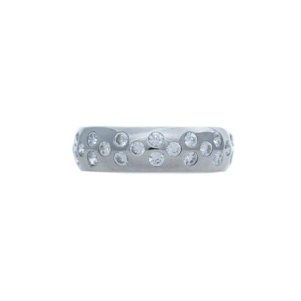 Sterling silver, rhodium plated, brilliant round cut cubic zirconia, rub over set, speckled ring.