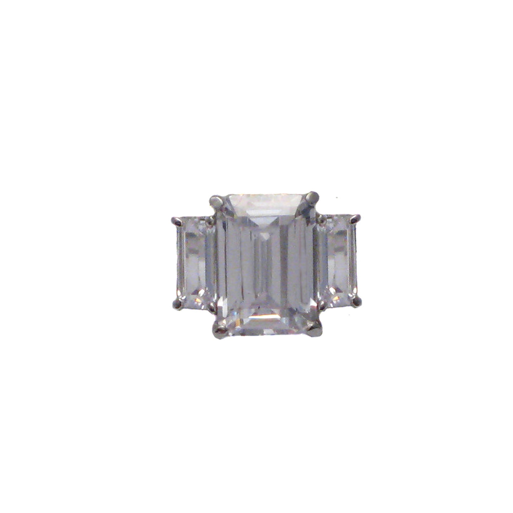 Sterling silver, rhodium plated, large emerald cut cubic zirconia ring with baguette cubic zirconia shoulders.