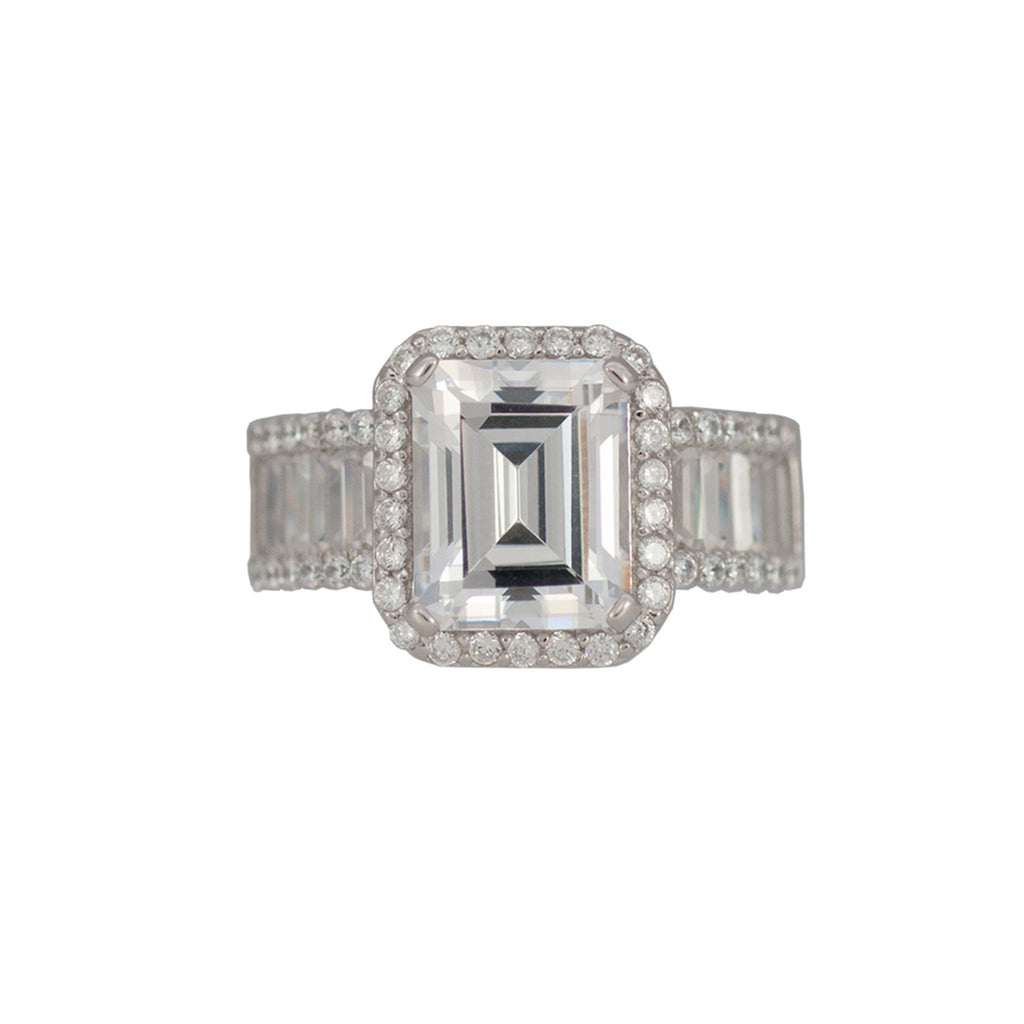 Sterling silver, rhodium plated, large emerald cut cubic zirconia ring with pave and baguette surround and shoulders. 
